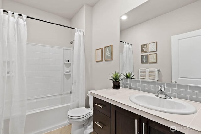 716 SE 11th Pl Unit 7, North Bend, WA 98045 - full bathroom with vanity, shower / tub combo, toilet, tasteful backsplash, and wood finished floors