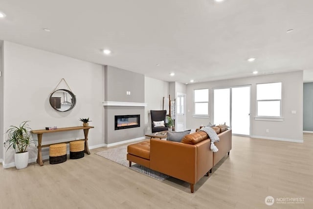 716 SE 11th Pl Unit 7, North Bend, WA 98045 - living area featuring recessed lighting, light wood-type flooring, a glass covered fireplace, and baseboards