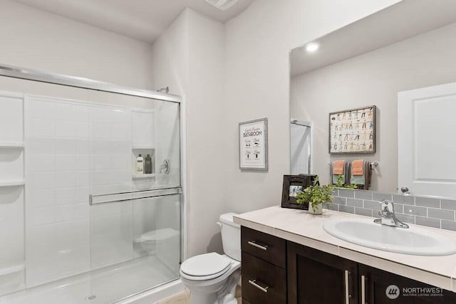 716 SE 11th Pl Unit 7, North Bend, WA 98045 - full bathroom with toilet, vanity, a shower stall, and tasteful backsplash