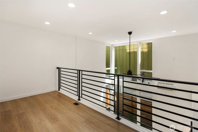 6320 41st Ave SW Unit D, Seattle, WA 98136 - corridor with an upstairs landing, wood finished floors, recessed lighting, and baseboards