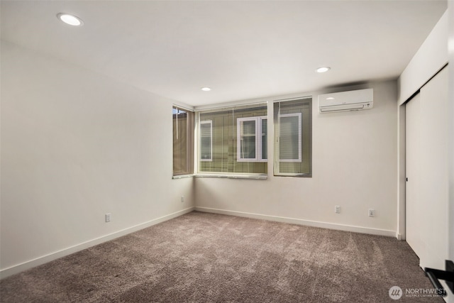 6320 41st Ave SW Unit D, Seattle, WA 98136 - spare room with a wall mounted air conditioner, carpet floors, baseboards, and recessed lighting