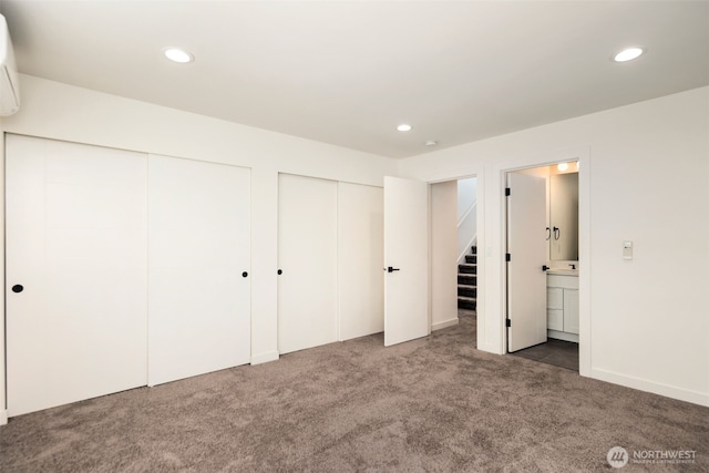 6320 41st Ave SW Unit D, Seattle, WA 98136 - unfurnished bedroom with multiple closets, carpet floors, and recessed lighting