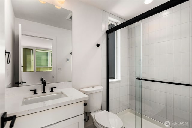 6320 41st Ave SW Unit D, Seattle, WA 98136 - bathroom with vanity, toilet, and a shower stall