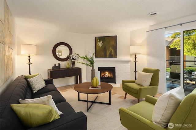 12223 NE Bel-Red Rd Unit D105, Bellevue, WA 98005 - living room featuring a fireplace