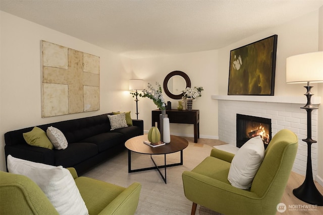 12223 NE Bel-Red Rd Unit D105, Bellevue, WA 98005 - living area featuring a brick fireplace