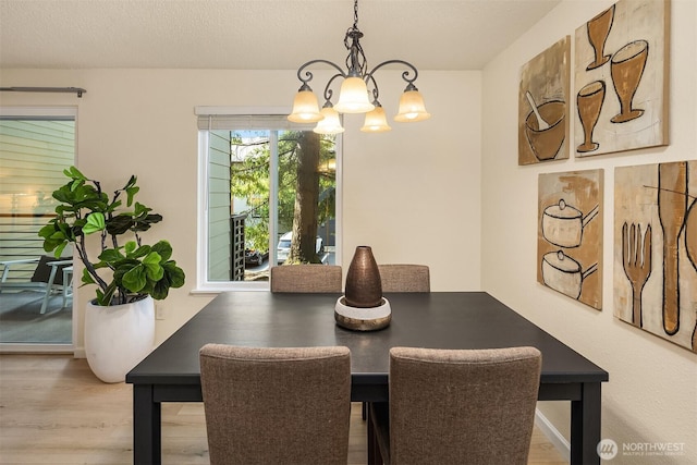 12223 NE Bel-Red Rd Unit D105, Bellevue, WA 98005 - dining room with a chandelier and wood finished floors