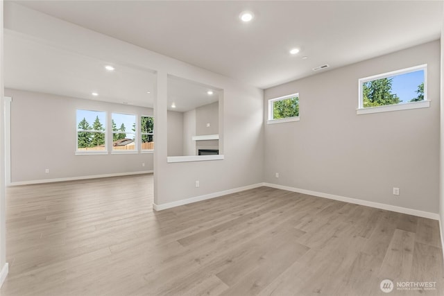 3822 98th Avenue Ct E Unit 9, Edgewood, WA 98371 - unfurnished living room with light wood-style flooring and recessed lighting