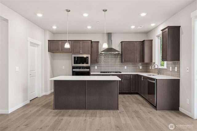 3822 98th Avenue Ct E Unit 9, Edgewood, WA 98371 - kitchen featuring wall chimney range hood, stainless steel appliances, light wood-style flooring, dark brown cabinetry, and recessed lighting