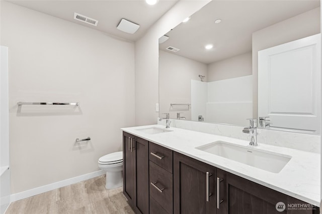 3822 98th Avenue Ct E Unit 9, Edgewood, WA 98371 - bathroom with double vanity, wood finished floors, a shower, a bathtub, and recessed lighting