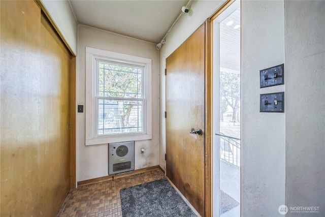 8495 Williams Rd E, Wilbur, WA 99185 - entryway with heating unit, baseboards, and brick patterned flooring
