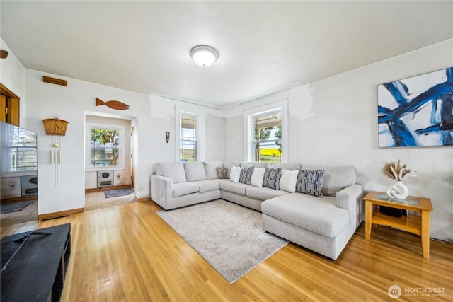 8495 Williams Rd E, Wilbur, WA 99185 - living area featuring light wood-style floors and healthy amount of natural light
