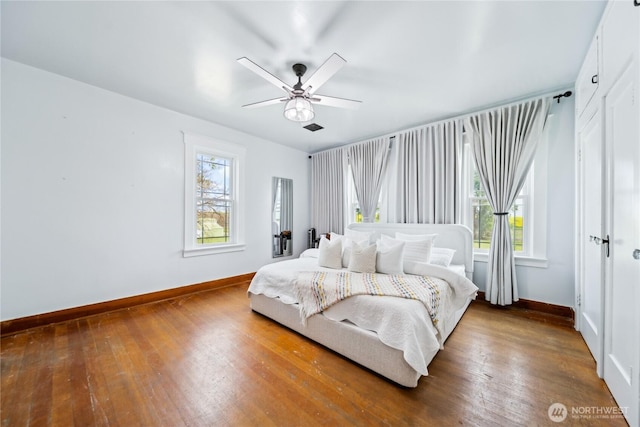 8495 Williams Rd E, Wilbur, WA 99185 - bedroom with baseboards, wood-type flooring, and ceiling fan