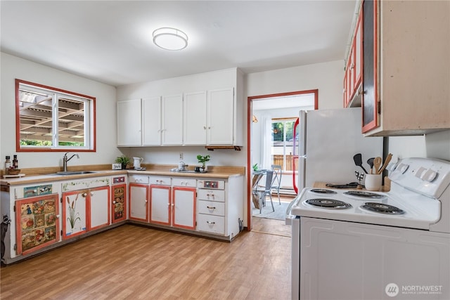 11816 40th Ave S, Tukwila, WA 98168 - kitchen with white appliances, a sink, light countertops, light wood-type flooring, and white cabinets