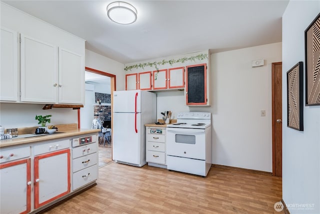 11816 40th Ave S, Tukwila, WA 98168 - kitchen featuring white appliances, light countertops, light wood-type flooring, and white cabinetry