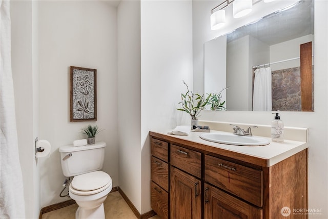 11816 40th Ave S, Tukwila, WA 98168 - bathroom featuring vanity, toilet, and baseboards