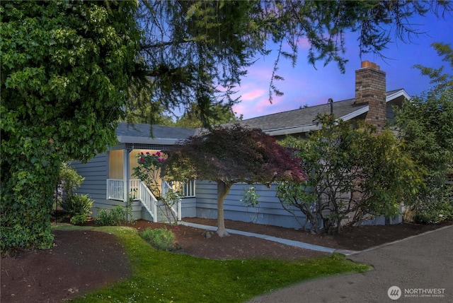 11816 40th Ave S, Tukwila, WA 98168 - view of property hidden behind natural elements with a chimney