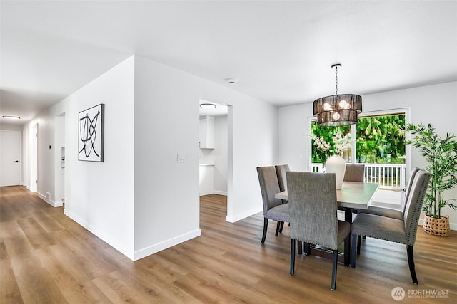 1231 121st Pl SE, Everett, WA 98208 - dining room featuring light wood finished floors, a chandelier, and baseboards