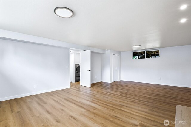 1231 121st Pl SE, Everett, WA 98208 - unfurnished room featuring washer / dryer, light wood-type flooring, and baseboards