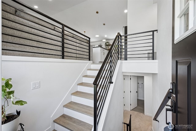 21710 104th Ave E, Graham, WA 98338 - stairway featuring recessed lighting, a towering ceiling, carpet flooring, and baseboards
