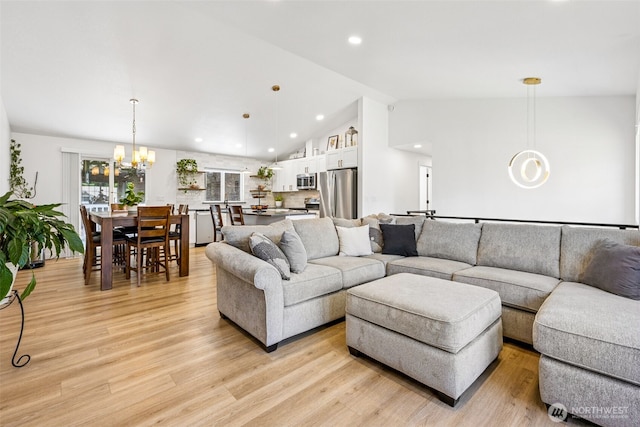 21710 104th Ave E, Graham, WA 98338 - living area featuring a chandelier, vaulted ceiling, light wood finished floors, and recessed lighting