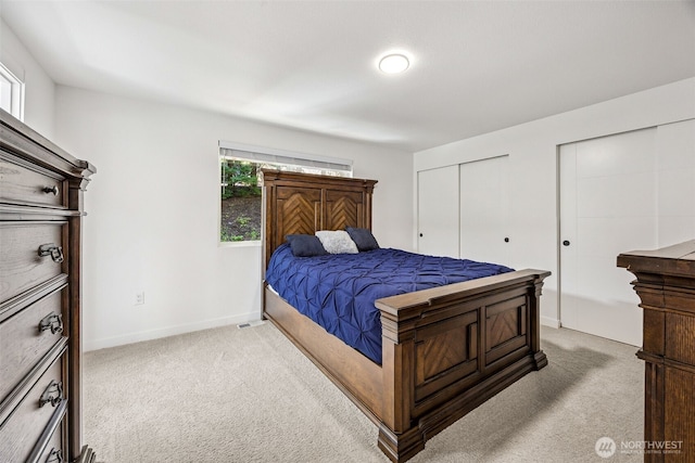 21710 104th Ave E, Graham, WA 98338 - carpeted bedroom with multiple closets and baseboards