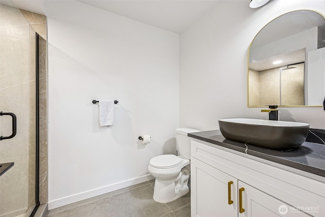 21710 104th Ave E, Graham, WA 98338 - full bathroom with a shower stall, vanity, toilet, baseboards, and tile patterned floors