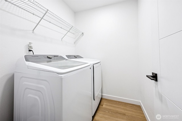 21710 104th Ave E, Graham, WA 98338 - laundry room featuring washer and clothes dryer, light wood finished floors, and baseboards