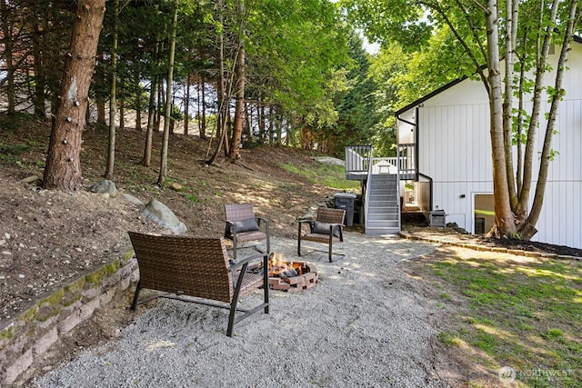 21710 104th Ave E, Graham, WA 98338 - view of patio / terrace with an outdoor fire pit, stairway, and a deck