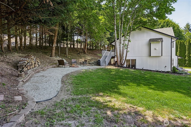 21710 104th Ave E, Graham, WA 98338 - view of green lawn with stairs and a deck