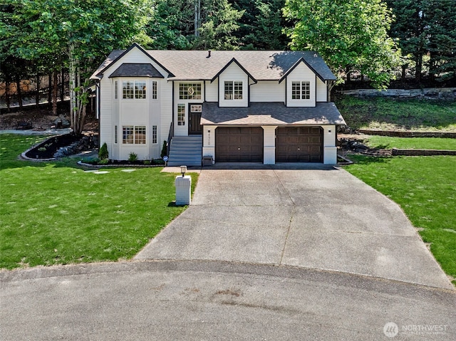 21710 104th Ave E, Graham, WA 98338 - bi-level home with driveway, a garage, a front yard, and a shingled roof