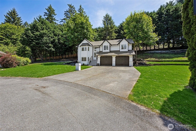 21710 104th Ave E, Graham, WA 98338 - view of front of house with concrete driveway, a front lawn, and a garage