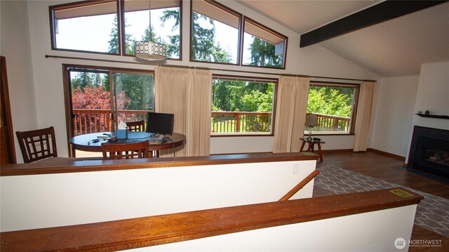 161 E Connemara Way, Shelton, WA 98584 - dining space featuring a fireplace with flush hearth, wood finished floors, plenty of natural light, and baseboards