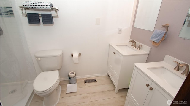 161 E Connemara Way, Shelton, WA 98584 - full bath with two vanities, a tile shower, toilet, and baseboards