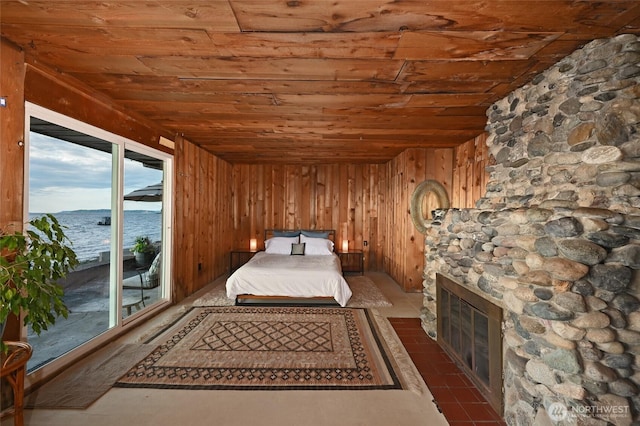 8204 Naketa Beach Walk, Mukilteo, WA 98275 - bedroom featuring wood ceiling, access to outside, wood walls, and a fireplace