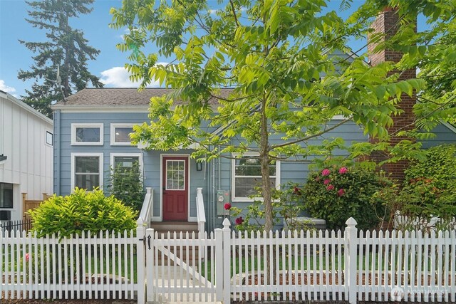 603 NW 52nd St, Seattle, WA 98107 - view of front of home with a fenced front yard and a gate