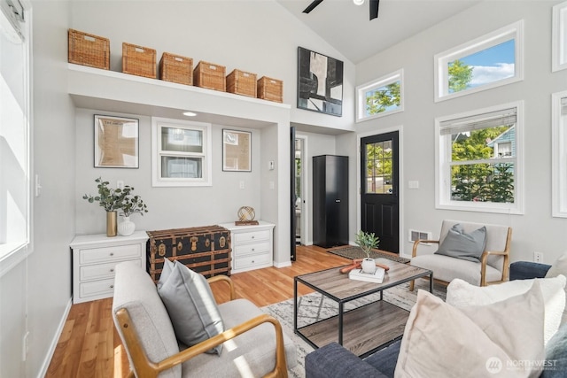 603 NW 52nd St, Seattle, WA 98107 - living room featuring high vaulted ceiling, ceiling fan, light wood-style floors, and plenty of natural light