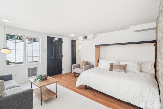 603 NW 52nd St, Seattle, WA 98107 - bedroom with wood finished floors, baseboards, and recessed lighting