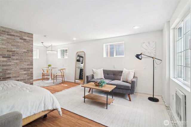 603 NW 52nd St, Seattle, WA 98107 - bedroom featuring multiple windows, wood finished floors, and baseboards