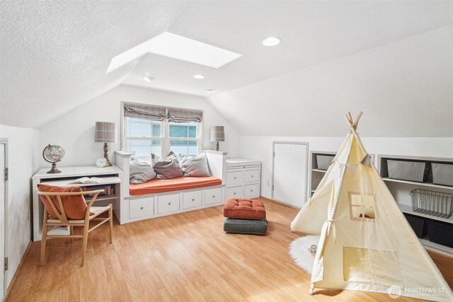 603 NW 52nd St, Seattle, WA 98107 - bedroom with light wood-style floors, a skylight, and lofted ceiling