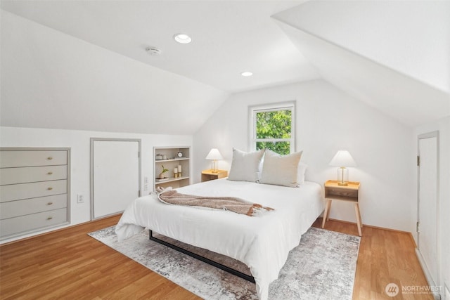 603 NW 52nd St, Seattle, WA 98107 - bedroom featuring vaulted ceiling and wood finished floors