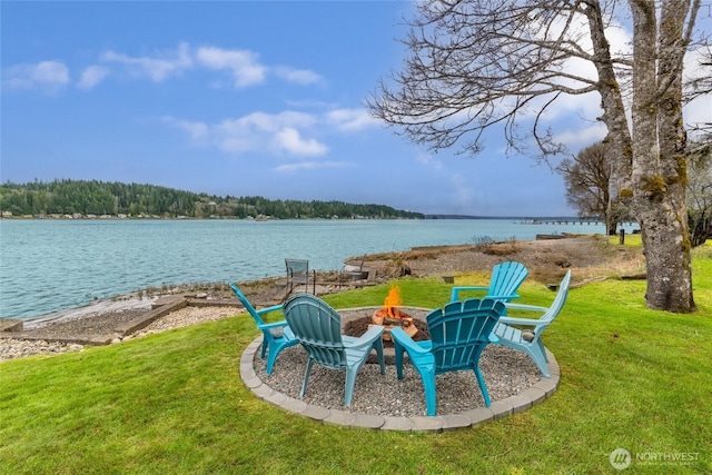 62 E N Bay Rd, Allyn, WA 98524 - view of grassy yard featuring an outdoor fire pit and a water view