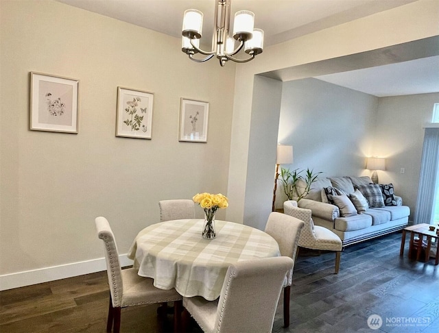 4459 249th Ter SE Unit 8-5, Issaquah, WA 98029 - dining area featuring a chandelier, dark wood-style flooring, and baseboards