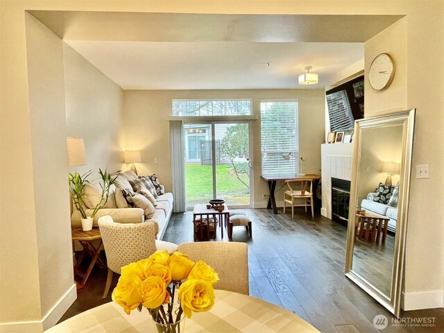 4459 249th Ter SE Unit 8-5, Issaquah, WA 98029 - living area with a fireplace, baseboards, and wood finished floors
