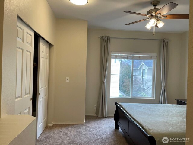 4459 249th Ter SE Unit 8-5, Issaquah, WA 98029 - bedroom with carpet flooring, baseboards, a closet, and a ceiling fan