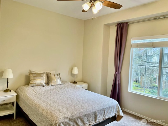 4459 249th Ter SE Unit 8-5, Issaquah, WA 98029 - bedroom with dark colored carpet, multiple windows, baseboards, and ceiling fan
