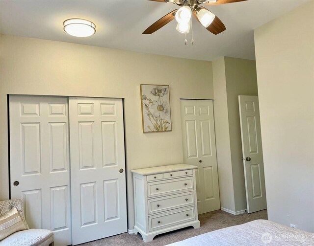 4459 249th Ter SE Unit 8-5, Issaquah, WA 98029 - bedroom with light colored carpet, baseboards, and a ceiling fan