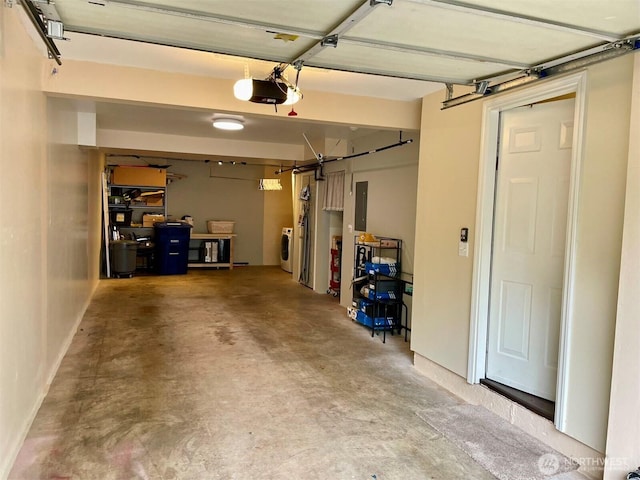 4459 249th Ter SE Unit 8-5, Issaquah, WA 98029 - garage with electric panel, a garage door opener, and washer / dryer