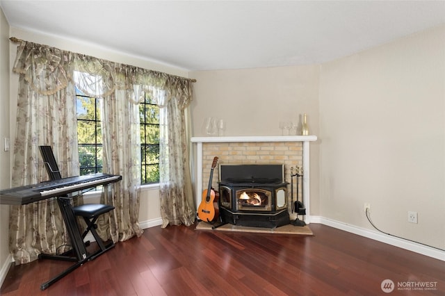 8407 18th Ave W Unit 6-104, Everett, WA 98204 - living area with wood finished floors, baseboards, and a wood stove