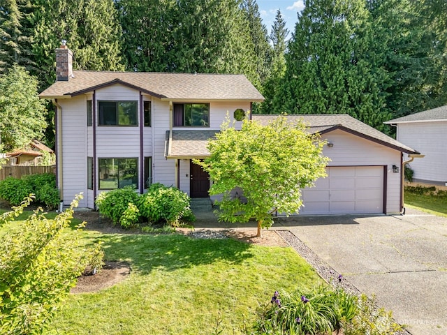 27805 NE 141st Pl, Duvall, WA 98019 - traditional home featuring asphalt driveway, a chimney, a garage, and a shingled roof