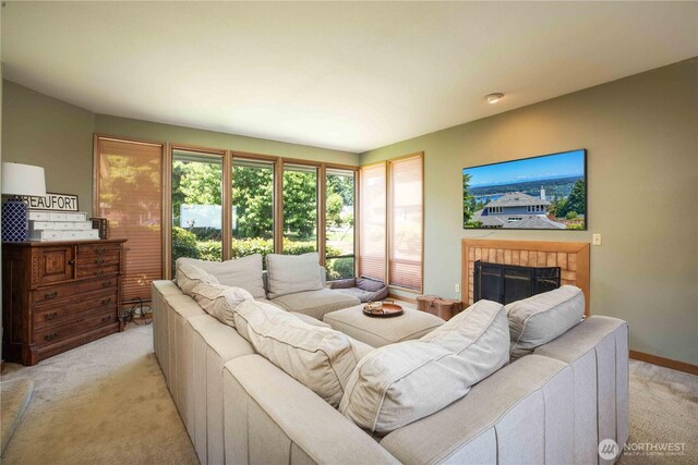 8082 Daniel Pl NW, Silverdale, WA 98383 - living area featuring light colored carpet, a fireplace, and baseboards